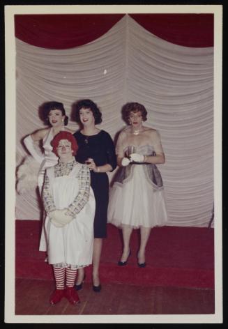 [Gail dressed as Raggedy Ann with Anita, Sandy, and a friend on stage at the Chevalier d’Éon, Halloween party, Hunter, NY]
