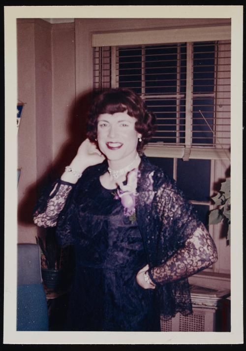 [Bobbie wearing red lipstick, posing in front of a window, location unknown]
