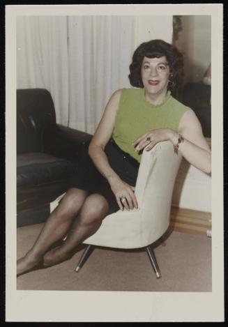 [Susanna sitting on a white chair, Casa Susanna, Hunter, NY]
