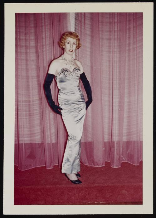 [Red head in a silver dress posing in front of curtains, Chevalier d'Eon, Hunter, NY]
