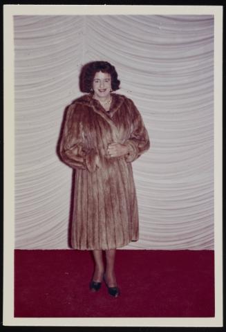 [Vicki in a fur coat posing on the stage at the Chevalier d’Éon, Hunter, NY]
