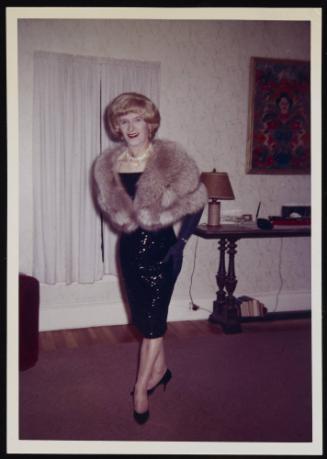 [Jody in a sequin dress and fur stole, location unknown]
