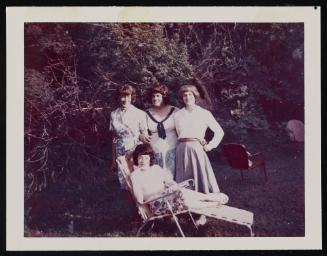 [Susanna sitting on a lawn chair with Daphne and two friends, Casa Susanna, Hunter, NY]
