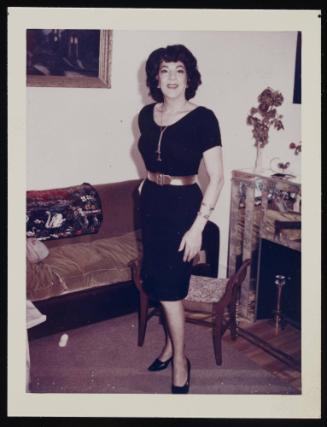 [Susanna in a black dress and gold belt, Casa Susanna, Hunter, NY]
