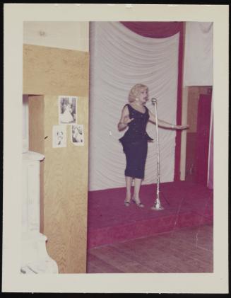 [Susanna in a blonde wig performing on stage, Chevalier d'Eon, Hunter, NY]
