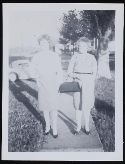 [Two friends on the sidewalk, location unknown]
