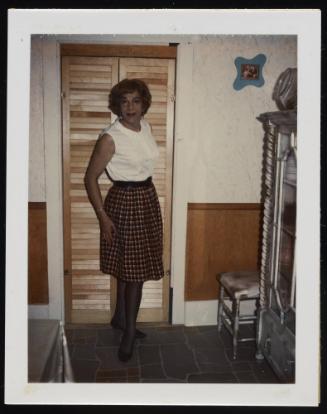 [Susanna in a checkered skirt, location unknown]

