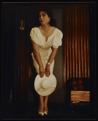 [Katherine Cummings in a white dress, location unknown]
