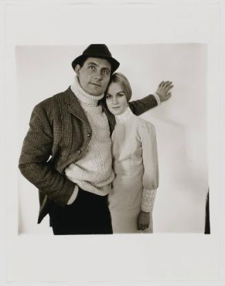 Guy pointing at one of picture boxes.