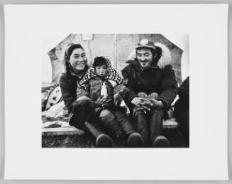 Bessie and Nick Ohooktook and child in their tent, Netsilik River camp