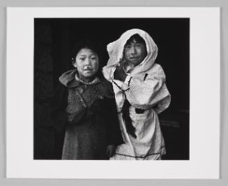 Two girls with irritated upper lips, dressed up in packing parkas