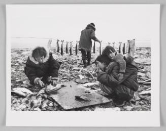 Nilaulaq cleaning char with Celina packing Willy, enjoying treat