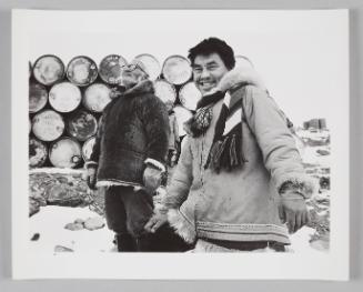 Karoo and his father waiting for the supply boat to arrive