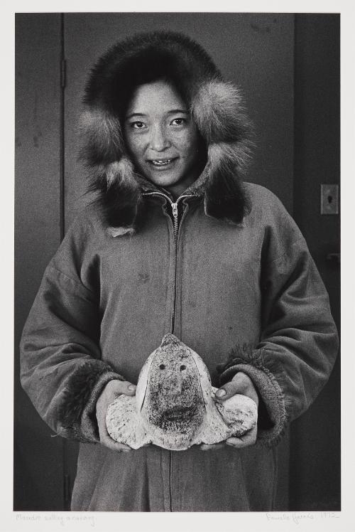 Maudie selling a carving