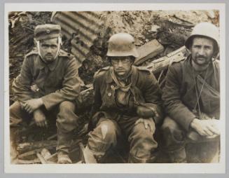[Three German prisoners, one wounded, captured in the attack on Vampire Farm near Potijze, during the Battle of the Menin Road Ridge, 20 September 1917]