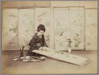 [Untitled: Woman painting screens]